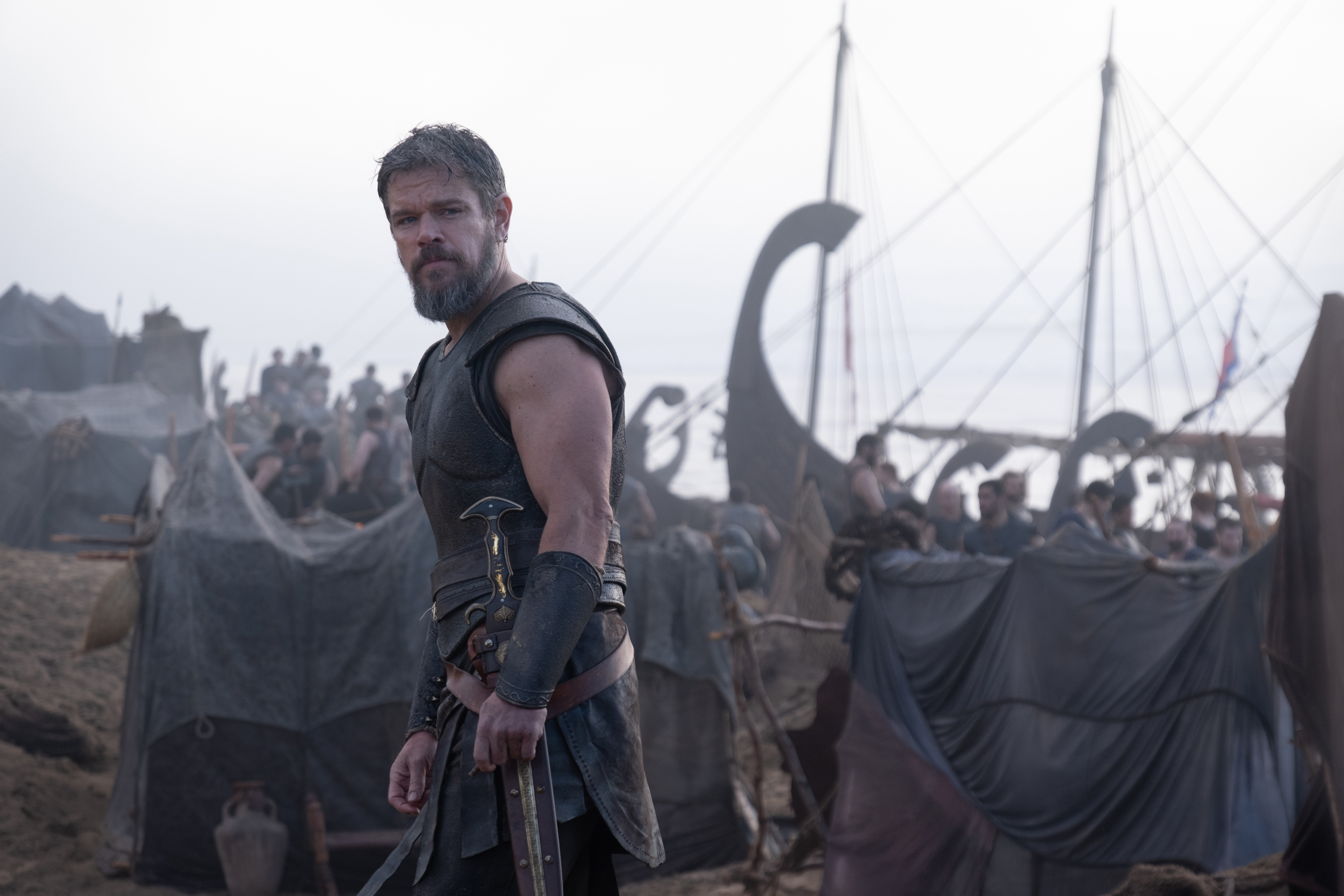 Matt Damon as Odysseus beside Greek ships in The Odyssey